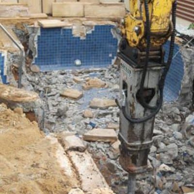 Pool demolition with hydraulic breaker