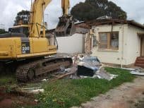 House demolition with excavator